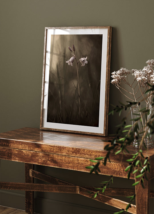 A small flower on the ground Poster