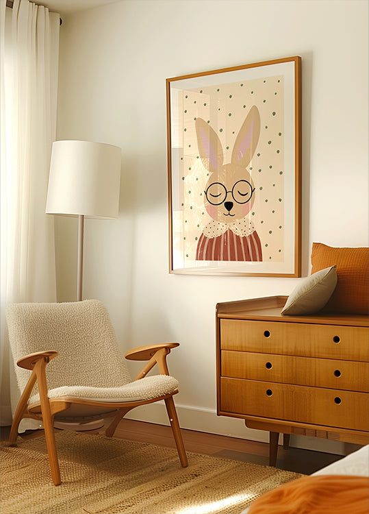 a cozy living room with a beige armchair, a wooden dresser, and a framed picture of a rabbit wearing glasses.