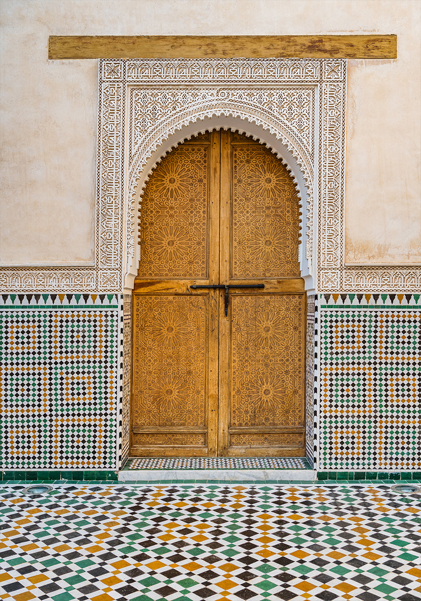 Decorated brown wooden door in Morocco Poster