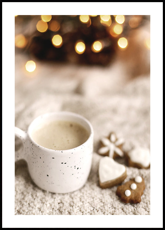 a cup of coffee next to some cookies