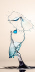 a dynamic water splash, with a blue object suspended in mid-air and a large splash of water cascading down, creating a sense of movement and energy.
