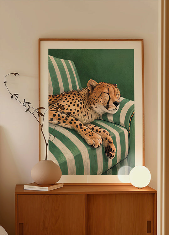 Sleepy Cheetah On A Green Chair Poster